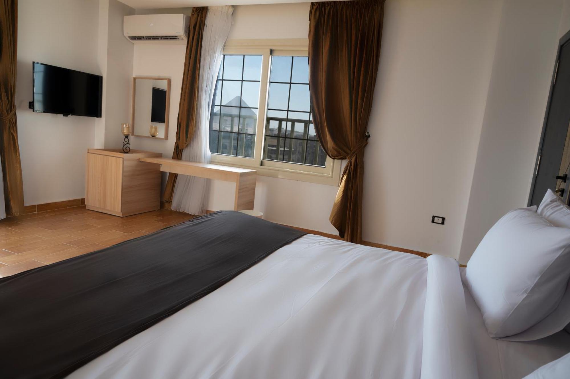 Palm Pyramids View Hotel Kafrat al Jabal Номер фото